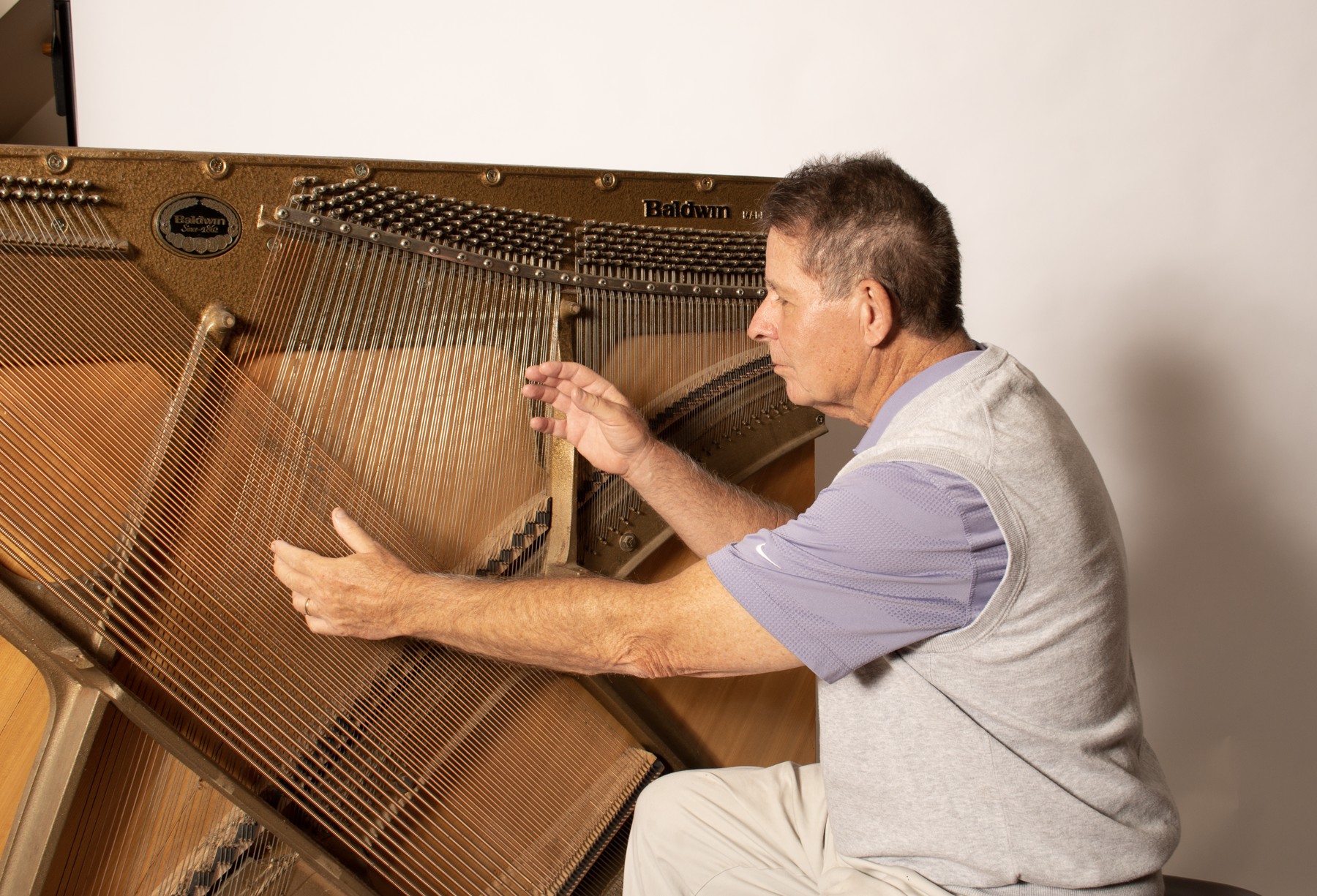 John Beaulieu playing exposed piano strings